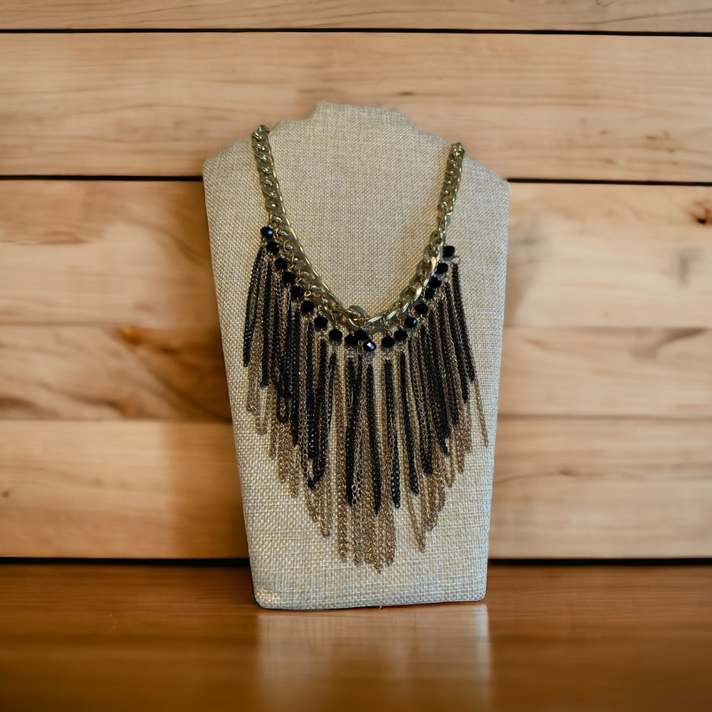 Dramatic black and gold bib necklace. Great condition for pre owned.